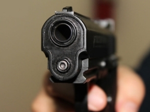 Armenian police officer mishandles weapon and causes injury
