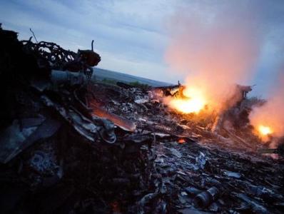 Report: MH17 broke up in air