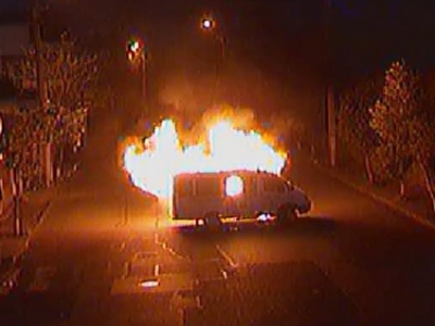 Armed group sets on fire already third police car at seized Yerevan police station