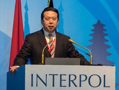 China prosecutor's office decides to detain Interpol ex-head