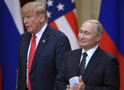 Trump jokes with Putin twice during meeting