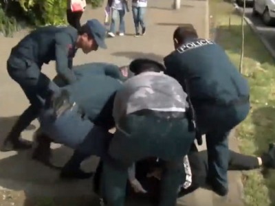 Police detain young man during rally outside Yerevan court