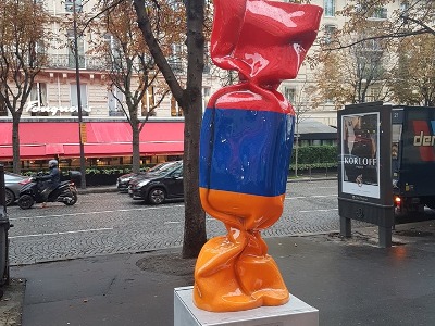 Candy sculpture wrapped in Armenian flag colors displayed in Paris