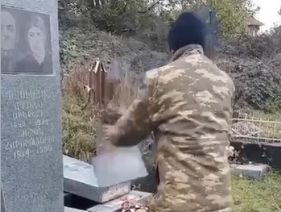 Azerbaijani soldiers destroying Armenian cemeteries in Nagorno-Karabakh