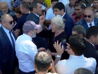 Some women tell Armenia acting PM they're employees of schools in Etchmiadzin during meeting in Gai village