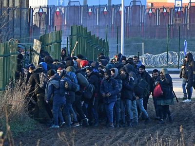 Poland police say group of 50 migrants broke through border with Belarus