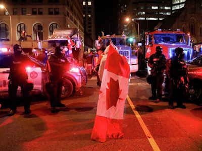 Clashes between police and protesters against anti-coronavirus measures in Ottawa