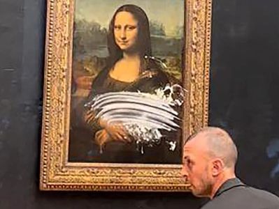 Man dressed as disabled woman throws cake at Da Vinci's 'Gioconda'
