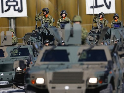 Japanese government approves sweeping review of defense policy