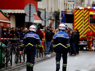 Kurdish community members hold silent march in memory of three dead in Paris shooting