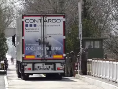Trucks carrying humanitarian aid to Syria cross Armenia’s Margara checkpoint on Turkey border