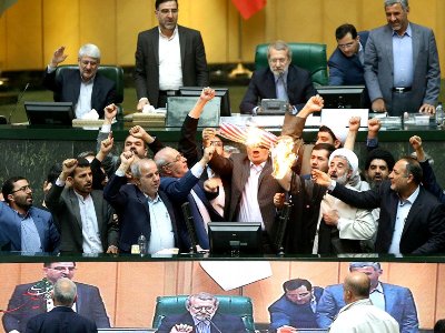 Iran’s parliamentarians burn nuclear deal