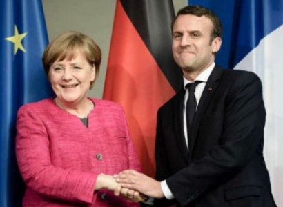 Macron and Merkel lay wreath at WW1 armistice site