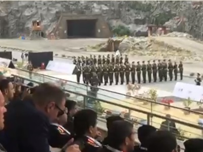 Armenian delegation members march during opening ceremony of IDEX 2019
