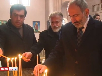Armenia premier lights candle in Spitak town church