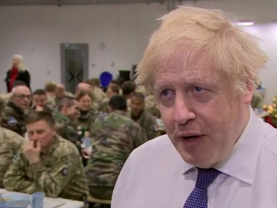 Boris Johnson serves Christmas lunch to British soldiers