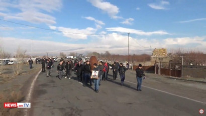 Relatives of deceased serviceman bringing coffin to Yerevan