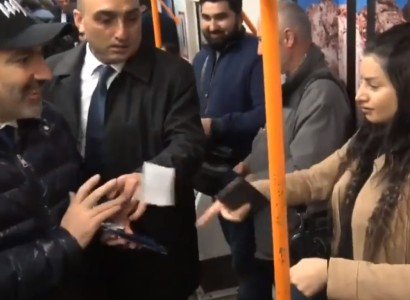 Girl rips YES booklet and throws it at Armenia PM in metro wagon