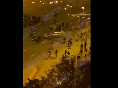 Car plows through security forces during night rally in Minsk