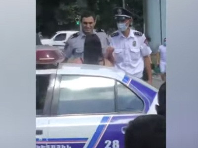 Facebook user posts video showing Armenian police officers apprehending young woman by pushing her around