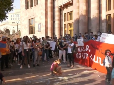 Citizens protesting against Amulsar gold mine project near government building, children drawing with chalks