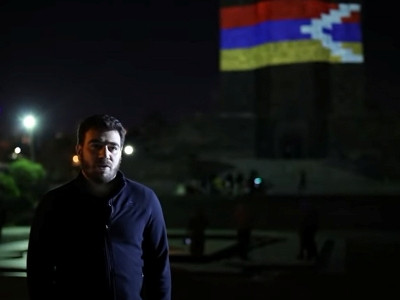 Mother Armenia monument in Yerevan is illuminated with Artsakh flag