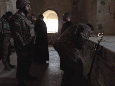 Armenian soldiers, clergymen place church cross under artillery fire in Artsakh