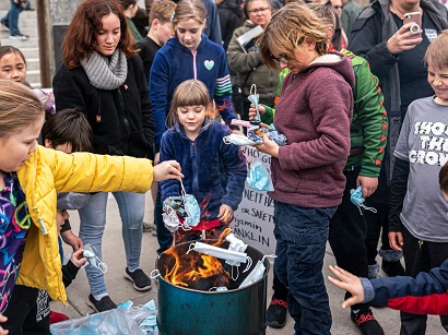 Idaho COVID-19 restriction protesters burn masks outside state Capitol