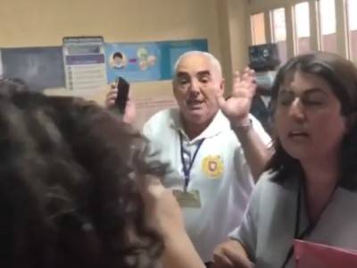 Armenia Civil Contract Party member obstructing work of opposition party proxy at polling station