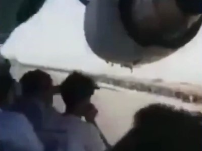 Afghan videotapes himself and other men clinging from US air force plane