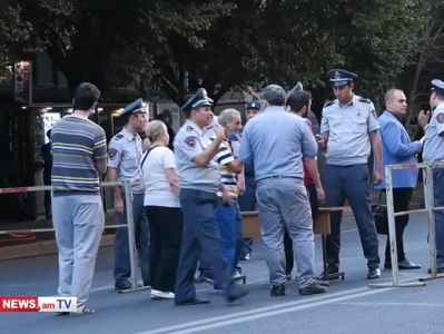 Police inspecting citizens with metal detectors before Independence Day event at Republic Square in Yerevan