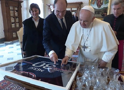 Pope Francis is presented with PSG shirt signed by Messi