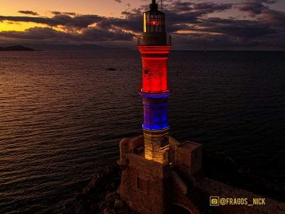 Crete island lighthouse illuminated with colors of Armenian tricolor
