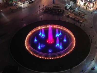 Fountains in Athens' central square illuminated with Armenian tricolor