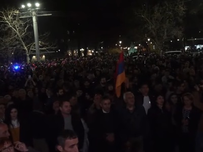 Rally participants carry large Karabakh flag in central Yerevan