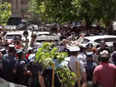 Armenian parliament deputy speaker's t-shirt is torn during police clashes
