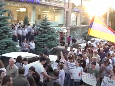 Resistance Movement members splash paint near Civil Contract party office