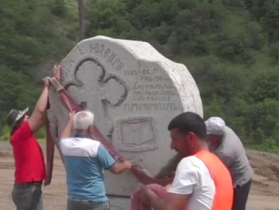 Azerbaijanis moving cross-stone on road of Berdzor