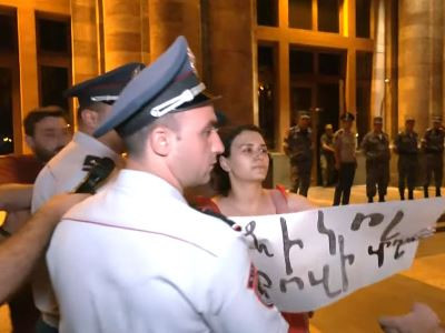 Police use force to detain citizens protesting against  government