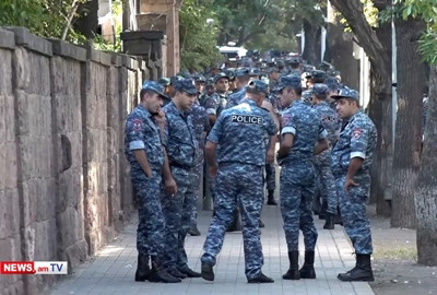 Armenia police form human wall armed with shields, close off road leading to parliament side entrance
