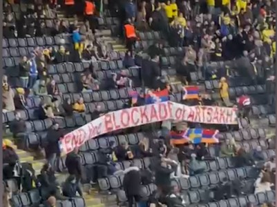 Azerbaijan assistant coach tugs Karabakh flag, tries to hit an Armenian during Sweden vs. Azerbaijan football game