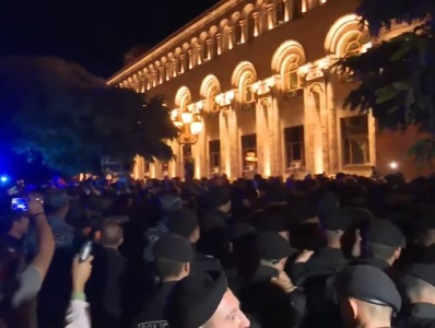 Police detain protesters outside government building