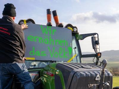 Angry farmers attempt to storm into ferry with Germany vice-chancellor aboard
