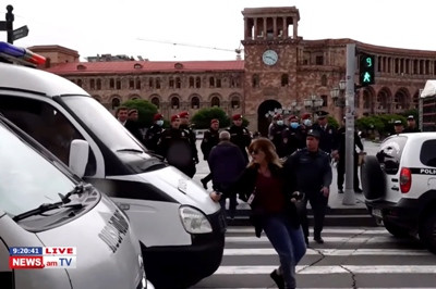 Police car deliberately drives toward reporter in downtown Yerevan