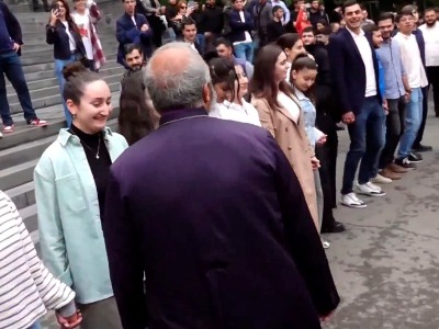 Archbishop Galstanyan is greeted with Armenian folk dance at Yerevan State University courtyard