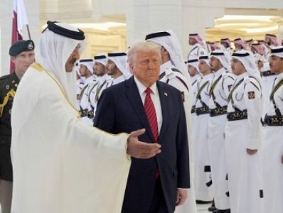 Trump welcomed in Qatar with mounted camels, red Cybertrucks