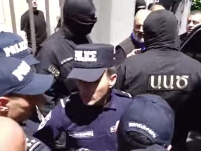 Masked Armenia National Security Service officers take Archbishop Bagrat Galstanyan away