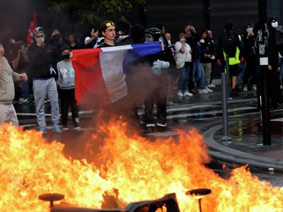 Clashes break out between protesters, police in central Paris
