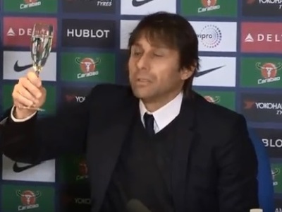 Chelsea boss Conte drinks champagne at press conference