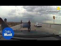 Police heroically save suicidal woman trying to jump off a bridge
